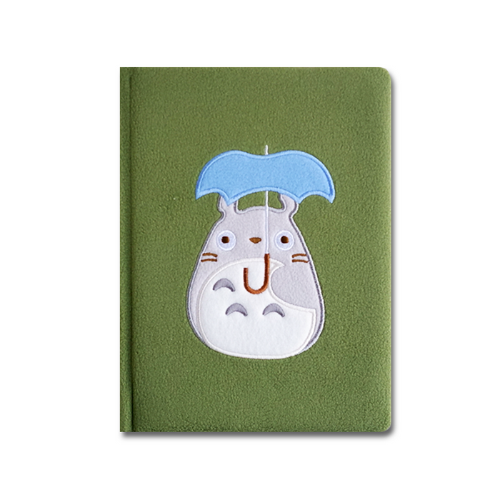 My Neighbor Totoro journal by Chronicle Books featuring Totoro and forest scene on a soft cover for note-taking or journaling.