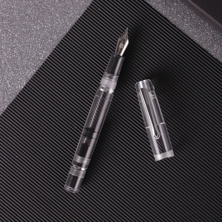 Nahvalur Original Demonstrator Fountain Pen showing transparent body and metal accents on a white background.