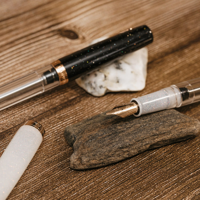 Nahvalur Original PLUS fountain pen with Lovina graphite body and Matira quartz accent, showcasing elegant design and craftsmanship.