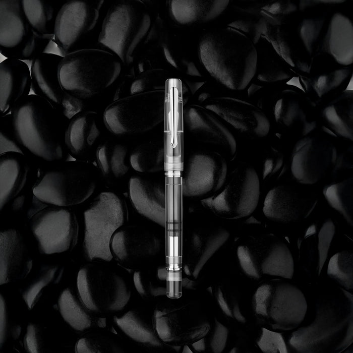 Nahvalur Original Demonstrator fountain pen with cap removed, showcasing the transparent body and fine writing tip.