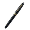 Omas Ogiva Nera fountain pen with black lacquer finish and gold accents, close-up of pen's detailed design.
