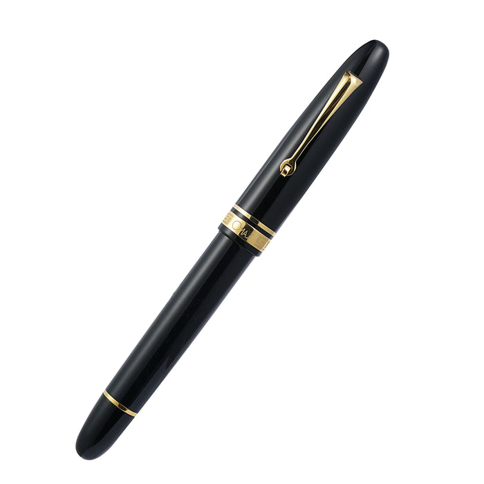 Omas Ogiva Nera fountain pen with black lacquer finish and gold accents, close-up of pen's detailed design.