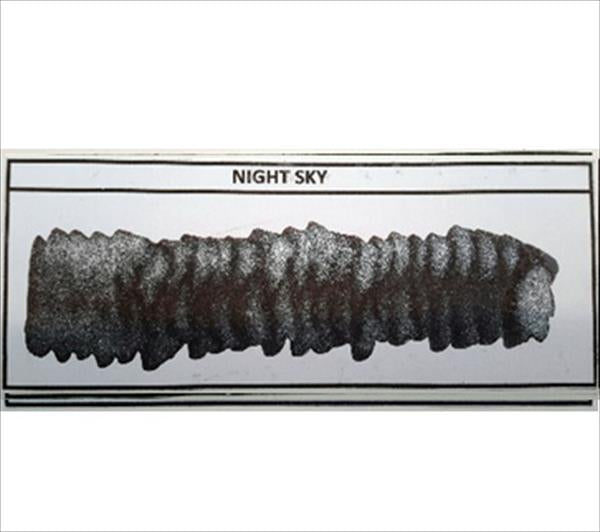 Diamine Shimmertastic Night Sky fountain pen ink with shimmering dark blue and star-like accents.