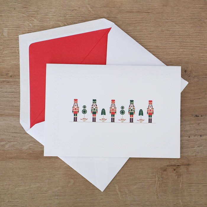 Rossi Christmas card featuring a colorful nutcracker soldier with festive holiday design and decorative elements.