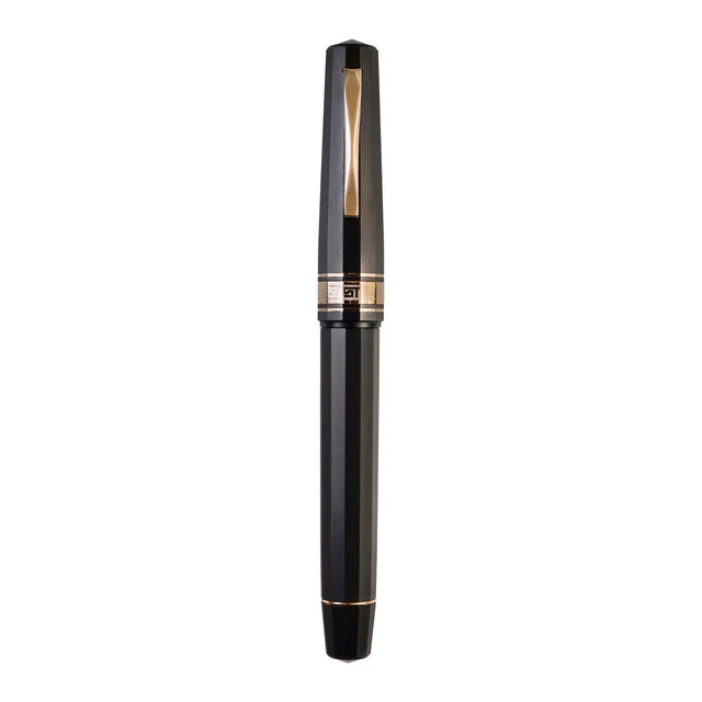 Omas Paragon limited edition fountain pen with elegant design and gold accents, showcased in a close-up image.