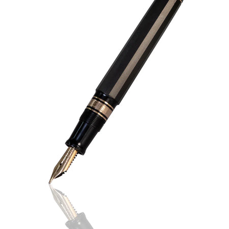 Omas Paragon limited edition fountain pen with gold accents and smooth black resin body, showcasing elegant craftsmanship.