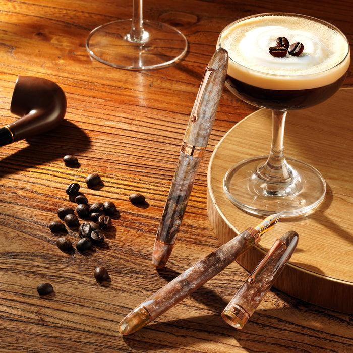 Omas Ogiva limited edition fountain pen with espresso martini design, featuring sleek black body and gold accents.