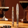 Omas Ogiva espresso martini limited edition fountain pen with sleek design and gold accents on a white background