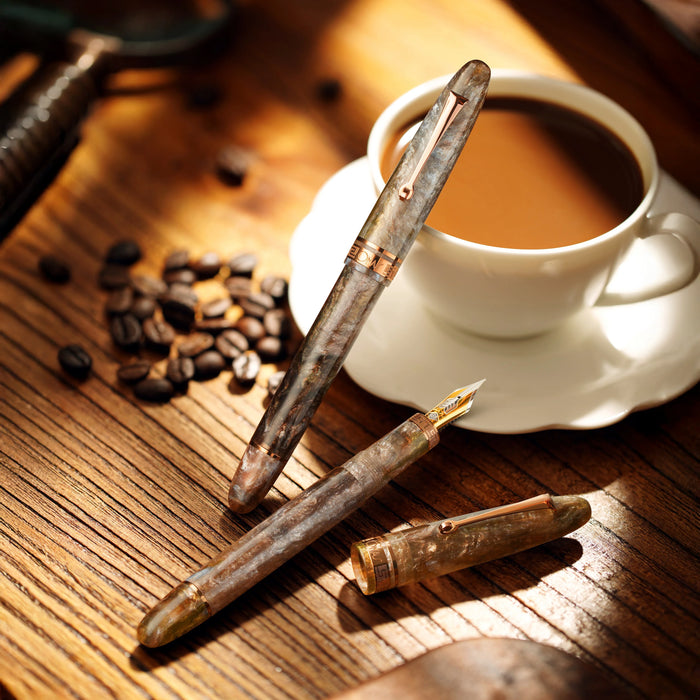 Omas Ogiva Limited Edition Espresso Martini fountain pen with sleek design and glossy finish on a white background.
