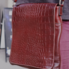 Munari Vachetta Cocco leather shoulder bag with adjustable strap and sleek design, featuring natural tan leather finish.