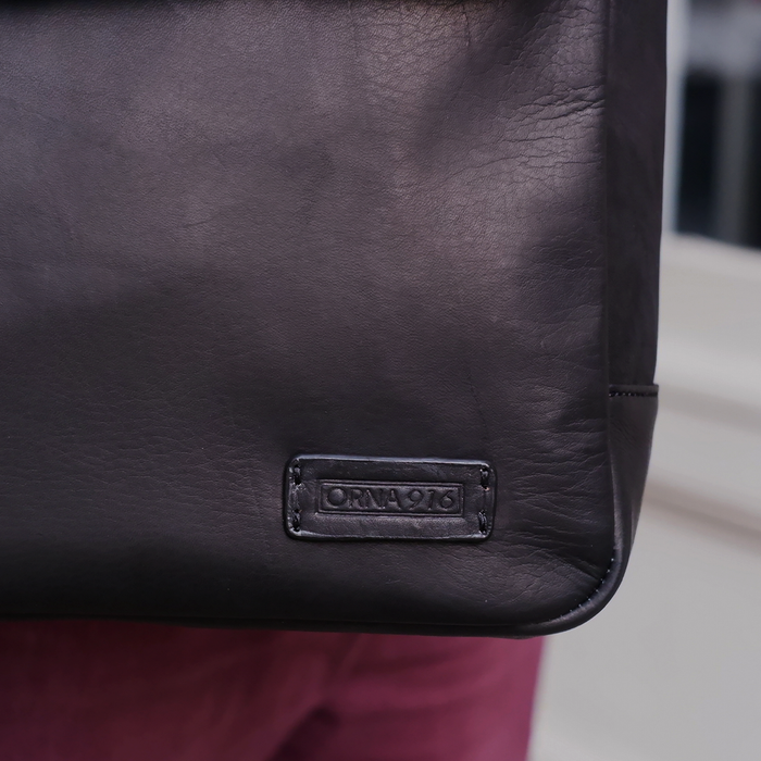 Orna Munari Smart briefcase bag with sleek design, featuring multiple compartments and a sturdy handle for professional use.