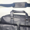 Orna blue briefcase with sleek design, sturdy handle, and secure zipper closure, perfect for professional use.