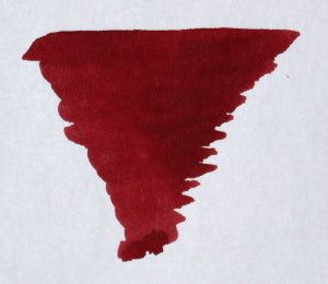 Diamine Ox Blood fountain pen ink cartridge in international size, showing the deep red ink inside the cartridge.