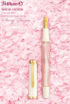Pelikan M200 Cherry Blossom fountain pen with pink and gold accents, showcasing elegant design and fine craftsmanship.