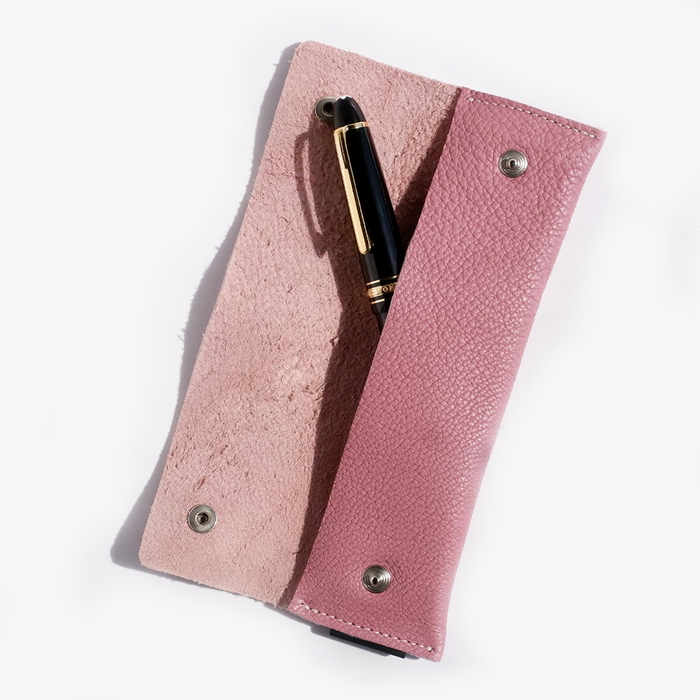 Pink San Lorenzo long pen case with a sleek, cylindrical design for storing pens and stationery.