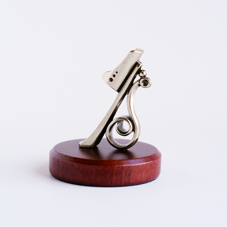 Bortoletti calligraphy pen rest in ceramic, designed to hold and support a calligraphy pen for writing or drawing.