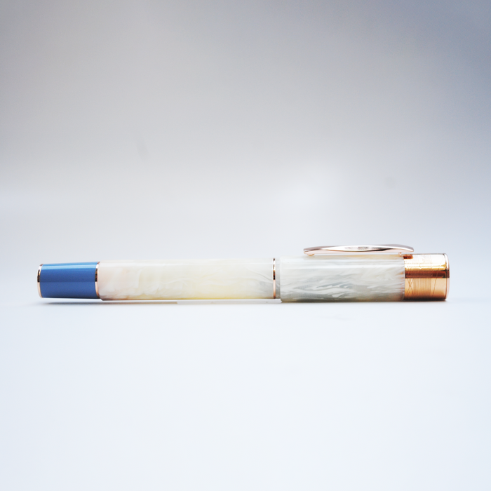 Gioia Partenope Ivory fountain pen with rose gold accents, showcasing elegant design and smooth writing tip.