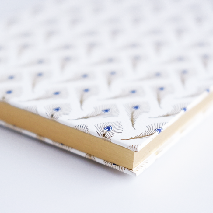 Rossi feather journal with peacock feather design, featuring a textured cover and elegant detailing for writing and note-taking.