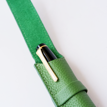 Green leather pen case by Eng Leather Co. with a single slot, designed to hold a single pen securely and stylishly.