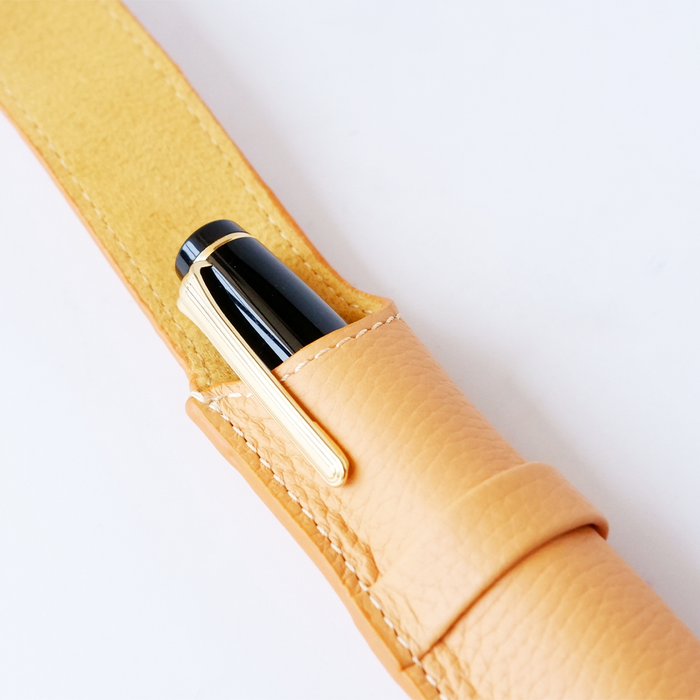Orange leather pen case with a single slot from Eng Leather Co., designed to hold one pen securely.