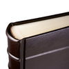 Dark leather photo album by Il Cartiglio with stitched binding and elegant pages, suitable for preserving cherished photographs.