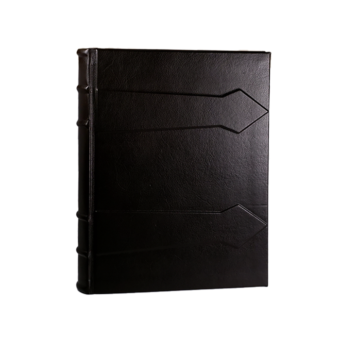 Dark leather photo album by Il Cartiglio, showing a close-up of the textured cover and binding.