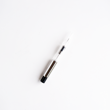 Silver piston converter for Pilot CON-70 fountain pen, showcasing the metallic, cylindrical interior component.