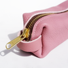 Pink San Lorenzo pen case with a smooth fabric exterior, designed to hold pens and small stationery items.