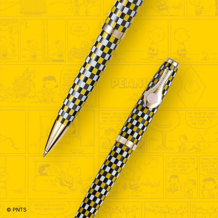 Esterbrook x Peanuts ballpoint pen featuring Snoopy and Charlie Brown design on a sleek, black pen body.