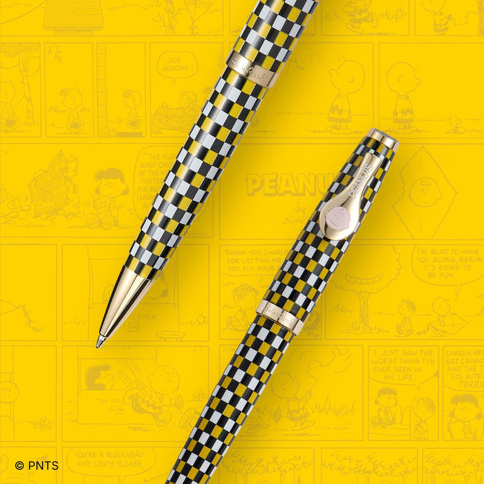 Esterbrook x Peanuts ballpoint pen featuring Snoopy and Charlie Brown design on a sleek, black pen body.