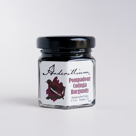 Anderillium Pompadour Cotinga Burgundy fountain pen ink bottle with burgundy-colored ink in a clear glass bottle.