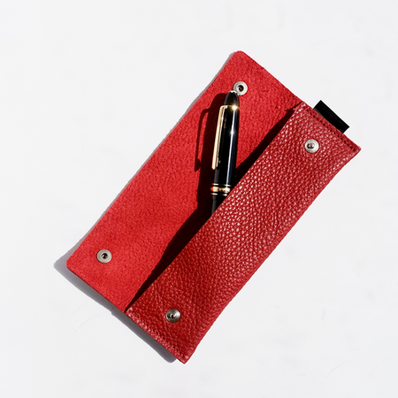Red San Lorenzo long pen case with a sleek rectangular design, ideal for storing multiple pens and writing accessories.
