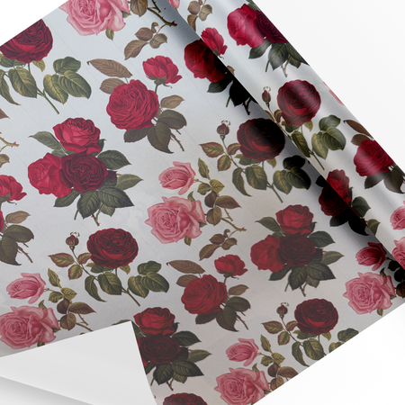 Rossi wrapping paper featuring elegant pink and red rose patterns, ideal for gift wrapping and special occasions.