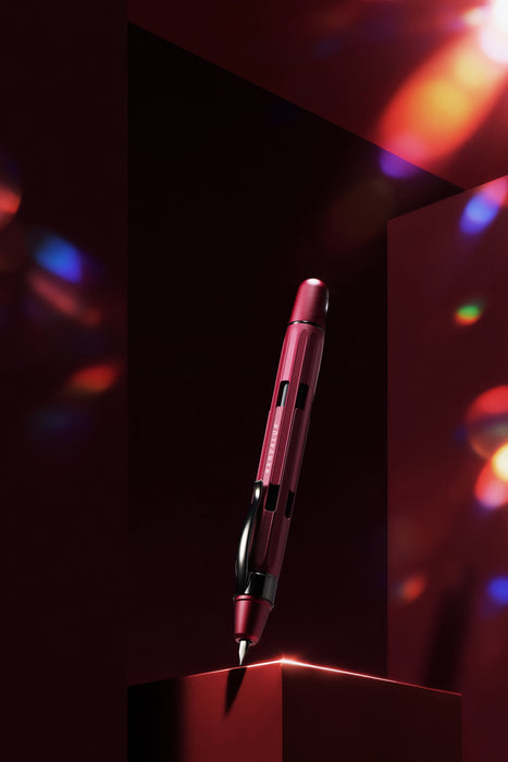 Nahvalur Eclipse fountain pen with emerald and ruby accents, featuring a sleek design and fine nib for elegant writing.