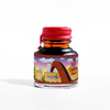 Papier Plume Rusty Rainbow shimmer fountain pen ink bottle with vibrant, iridescent orange and gold hues.
