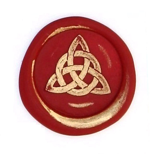 Close-up of a Bortoletti wax seal stamp displaying a detailed symbol engraved on the wax seal.