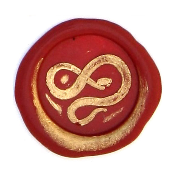 Bortoletti Symbol wax seal in golden color with intricate design, used for sealing letters or invitations.