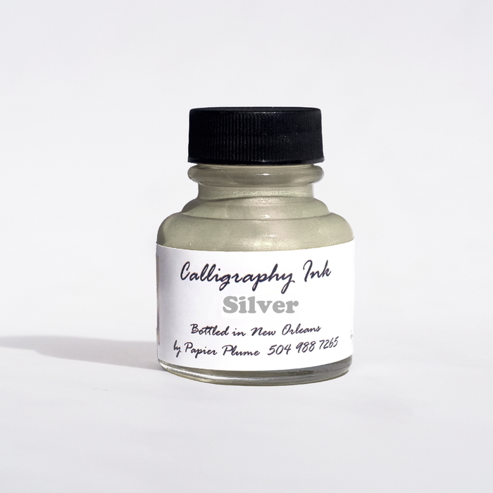 Silver Bottled Calligraphy Ink by Papier Plume, showcasing a sleek metallic ink bottle for elegant calligraphy projects.