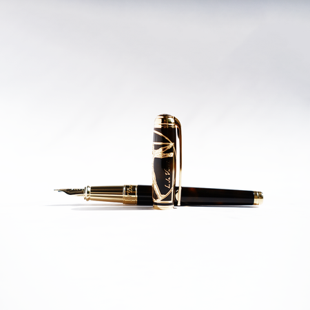 S.T. Dupont Line D Vitruvian Man limited edition fountain pen with detailed design and gold accents on a white background.