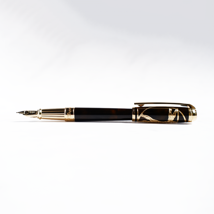 S.T. Dupont Line D Vitruvian Man limited edition fountain pen with detailed design and gold accents.