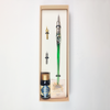 Set of 20 green Bortoletti glass dipping pens arranged on a white surface with ink bottles and paper.