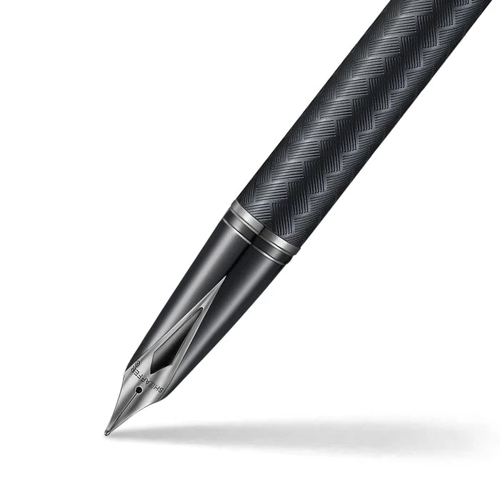 Black matte Sheaffer Legacy Chevron fountain pen with gold accents, showcasing its elegant design and smooth writing nib.