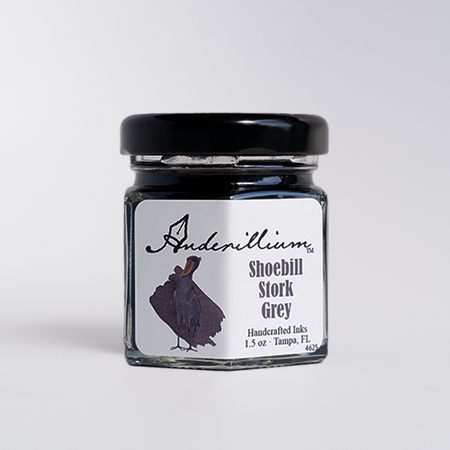Anderillium Shoebill Stork Grey fountain pen ink bottle with label, showcasing the grey ink color and elegant packaging.