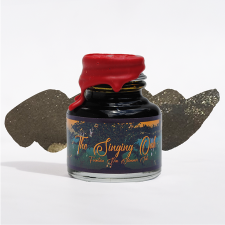 Papier Plume Singing Oak shimmer fountain pen ink bottle with colorful ink swatch and elegant label design.