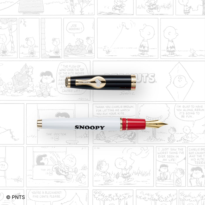 Esterbrook Snoopy Estie fountain pen with comic-themed background featuring Snoopy from the PEANUTS series.