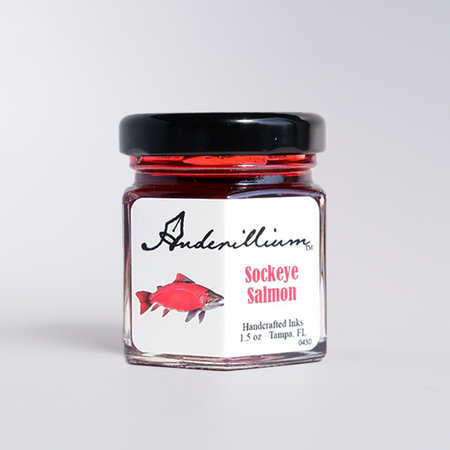 Anderillium Sockeye Salmon fountain pen ink bottle with vibrant red-orange ink, suitable for writing and calligraphy.