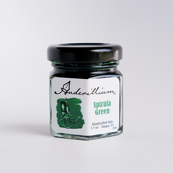 Anderillium Spirula Green fountain pen ink bottle with vibrant green ink in a clear glass container.
