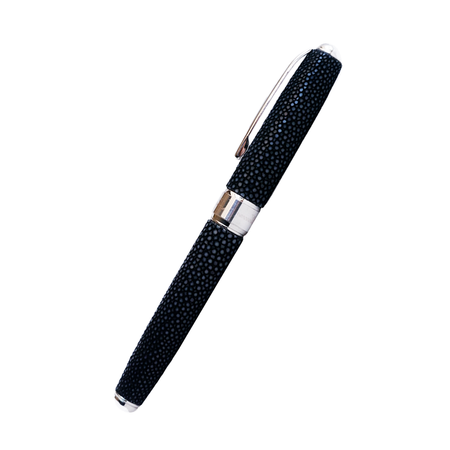 Grifos fountain pen with volcanic grey resin barrel and gold accents, featuring a sleek, ergonomic design for smooth writing.