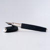 Grifos Papier Plume Raya Volcanic Grey fountain pen with sleek grey barrel and gold accents, close-up view of the pen.