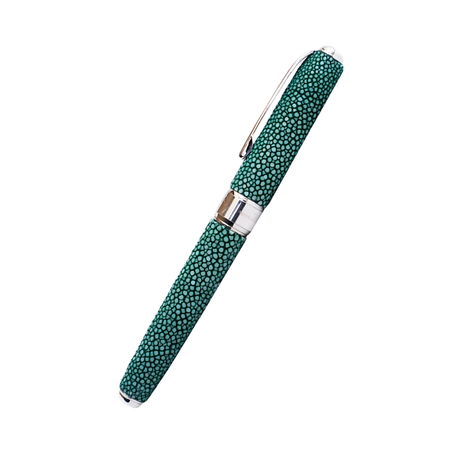 Grifos Fountain Pen with Raya Green Papier Plume ink, featuring a sleek design and green accents on a stringray leather background.
